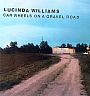 WILLIAMS LUCINDA /USA/ - Car wheels on a gravel road